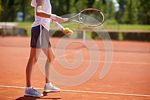 Tennis player serving tennis balls