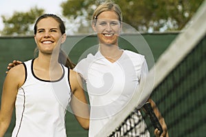 Tennis Players arms around Each Other