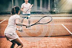 Tennis players playing a match on the court