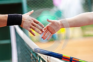 Tennis players shake hands after match photo