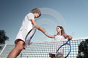 Tennis players shaking hands, fair play