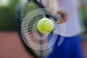 Tennis racket and ball photo