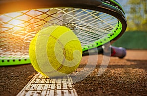 Tennis racket and ball on the tennis court