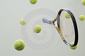 Tennis racket with balls.