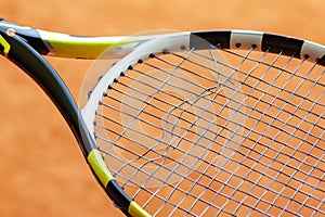 Tennis racket with broken strings