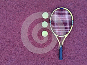 tennis racket with a tennis ball on a tennis court photo