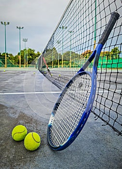 Tennis racket and tennis balls.