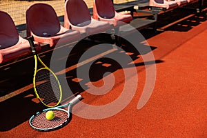 tennis racket with tennis balls on a tennis court photo