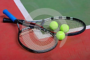 Tennis rackets, balls and court