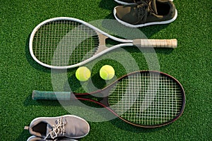 Tennis rackets with balls and sports shoes