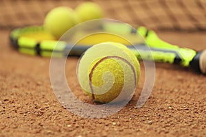 Tennis racquet tennis balls on clay court