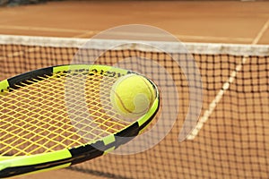 Tennis racquet tennis ball against clay court