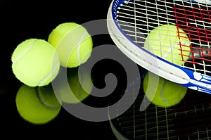 Tennis racquets and 3 balls