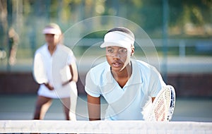 Tennis, sport and serious black woman on outdoor court, train and fitness, collaboration and ready for game. Exercise