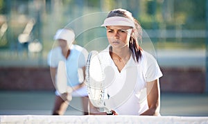 Tennis, sport and serious woman on outdoor court, training and fitness with collaboration and ready for game. Exercise