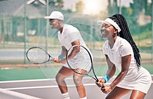 Tennis, sports and competition with a black woman and doubles partner playing a game on a court outdoor together