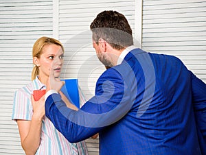 Tense conversation or quarrel between colleagues. Boss discriminate female worker. Discrimination and personal attitude photo