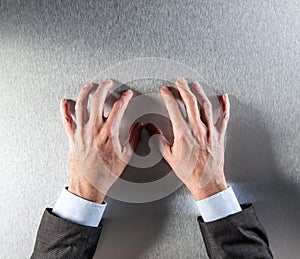 Tensed businessman hands expressing impatience, stress or self-controlled anger