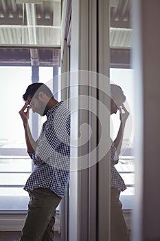 Tensed businessman standing in office