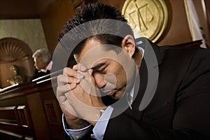 Tensed Man Sitting In Courtroom photo