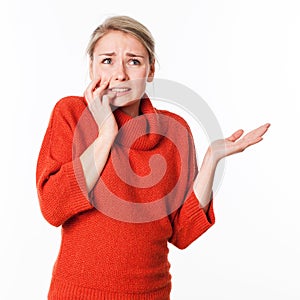 Tensed woman expressing panic looking up for imagination