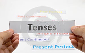 Tenses cards over white background photo