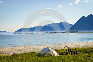 Tent and bike on beach, Lofoten Norway