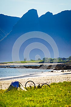 Tent and bike on beach, Lofoten Norway