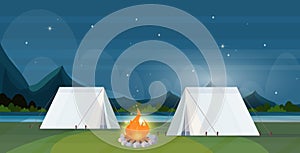 Tent camping area with campfire night campsite summer camp travel vacation concept mountains landscape beautiful nature