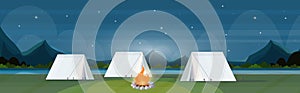 Tent camping area with campfire night campsite summer camp travel vacation concept mountains landscape beautiful nature