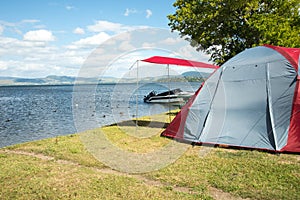 Tent on a camping site near a lake