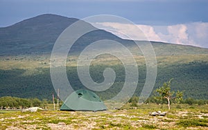 Tent in Front of a Big Mountain