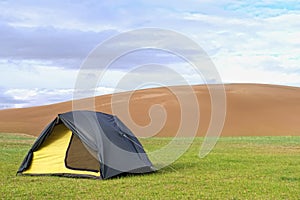 Tent on a green lawn