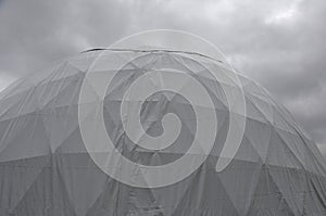 Tent with hemispherical structure with triangle support frame. The white plastic is made of white plastic tarpaulin. The casing ha