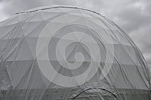 Tent with hemispherical structure with triangle support frame. The white plastic is made of white plastic tarpaulin. The casing ha
