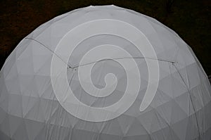 Tent with hemispherical structure with triangle support frame. The white plastic is made of white plastic tarpaulin. The casing ha