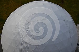 Tent with hemispherical structure with triangle support frame. The white plastic is made of white plastic tarpaulin. The casing ha