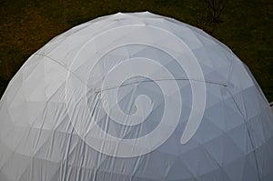 Tent with hemispherical structure with triangle support frame. The white plastic is made of white plastic tarpaulin. The casing ha