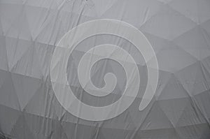 Tent with hemispherical structure with triangle support frame. The white plastic is made of white plastic tarpaulin. The casing ha