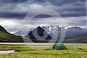 Tent on the lake coast