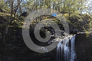 Tent piched at the top of the falls of falloch