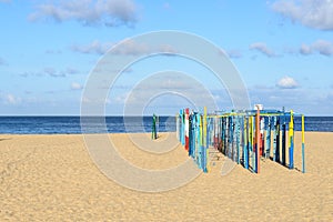 Tent poles on the beach, Nazare (Portugal)