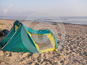Tent on the sand beach in front of ocean baltic sea in Germany
