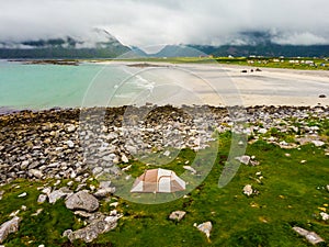 Tent on sea shore, Skagsanden Beach Lofoten Norway