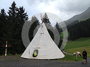 Tent, in the shape of a tipi, in a mountainous alpine holiday area