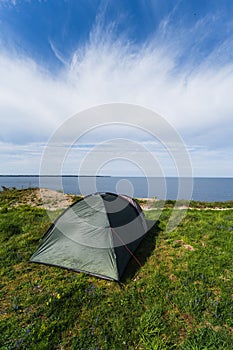 Tent on the shore of the Baltic Sea in Paldiski on a summer day. Vertical photo