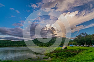 Tent spots along the reservoir in the middle of the fores