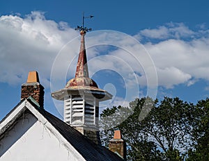 Tented roof with weather vane