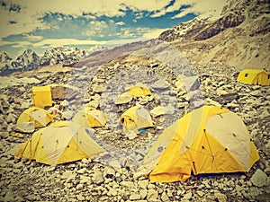 Tents in Everest Base Camp in cloudy day, Nepal, vintage retro.