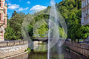 Tepla River with fountains and Promenade street in Karlovy Vary